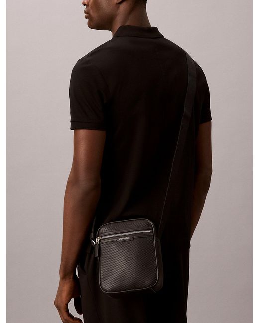 Calvin Klein Black Perforated Faux Leather Reporter Bag for men
