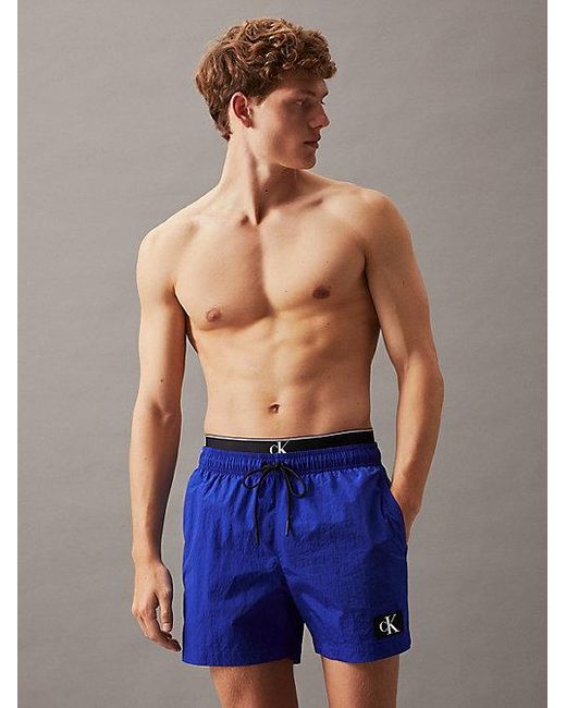 Bañador corto con cinturilla doble - CK Monogram Calvin Klein de hombre de color Blue
