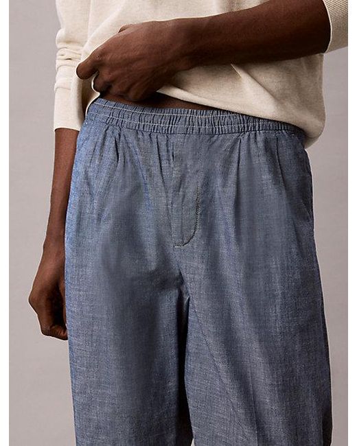 Calvin Klein Blue Jeans Cotton Chambray Drawstring Trousers for men