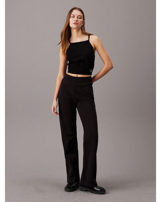 Pantalon de jogging évasé avec monogramme Calvin Klein en coloris Black