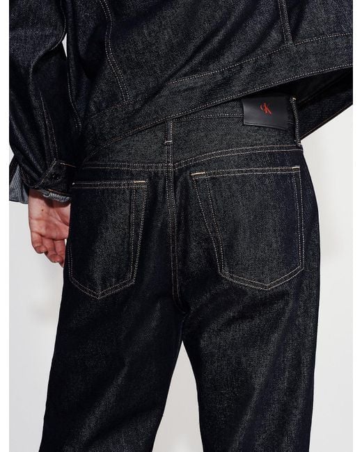 Calvin Klein Red 90S Straight Asymmetric Jeans for men
