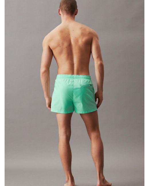 Short de bain court avec cordon de serrage Calvin Klein pour homme en coloris Green