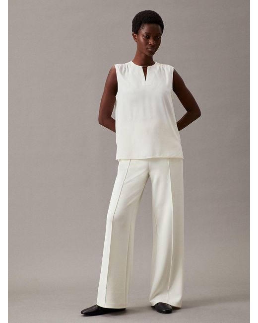 Pantalon à jambes larges en maille technique Calvin Klein en coloris White