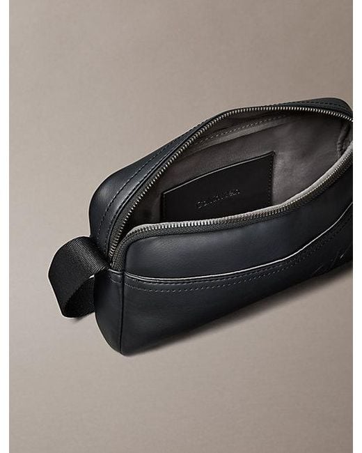 Calvin Klein Black Embossed Monogram Logo Camera Bag for men