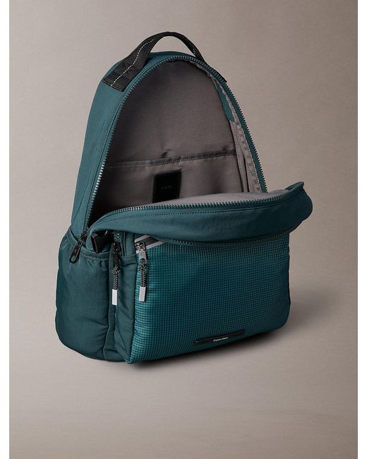 Calvin Klein Blue Striped Utility Zip Round Backpack for men