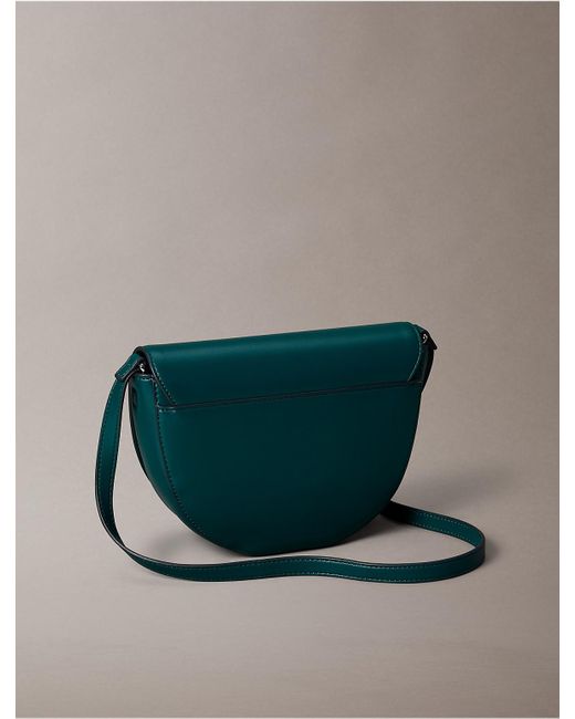 Calvin Klein Green Embossed Monogram Logo Saddle Bag