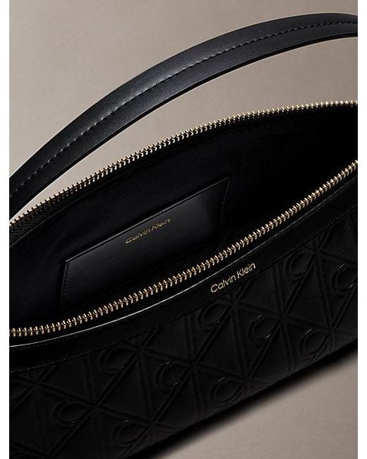 Calvin Klein Black Debossed Allover Emblem Logo Long Shoulder Bag