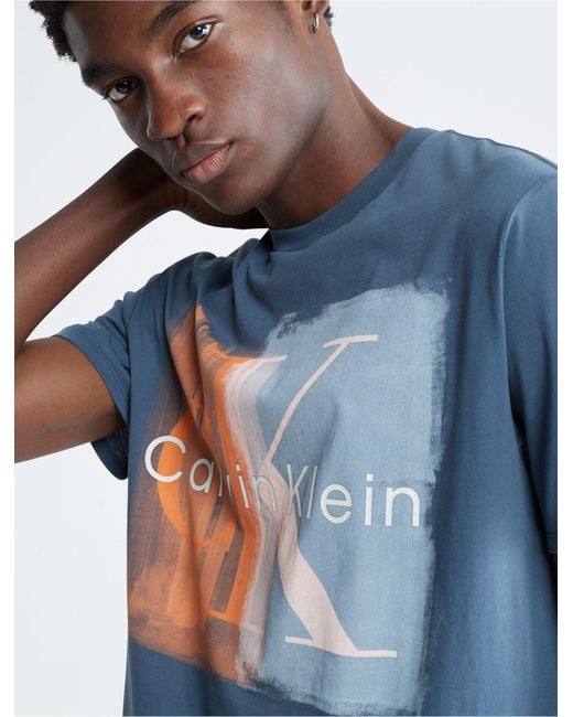 https://cdna.lystit.com/520/650/n/photos/calvinklein/e969d095/calvin-klein-Blue-Edge-Contrast-Monogram-Logo-Crewneck-T-shirt.jpeg