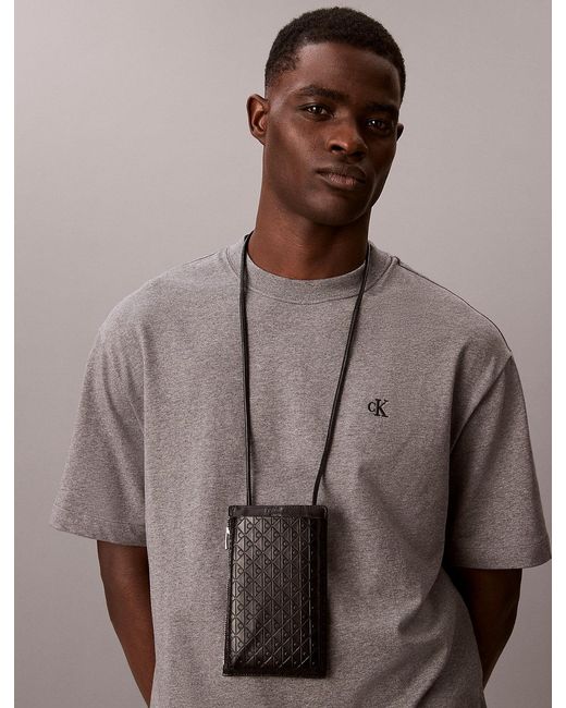 Calvin Klein Black Embossed Emblem Logo Phone Crossbody for men