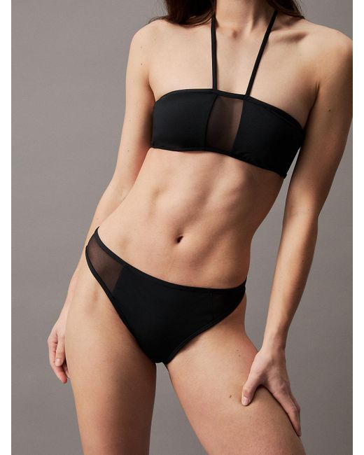 Bas de bikini avec pans transparents Calvin Klein en coloris Black