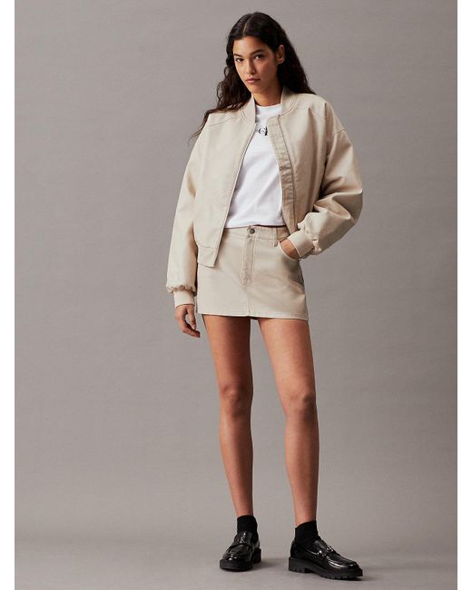 Micro-jupe en similicuir Calvin Klein en coloris Brown