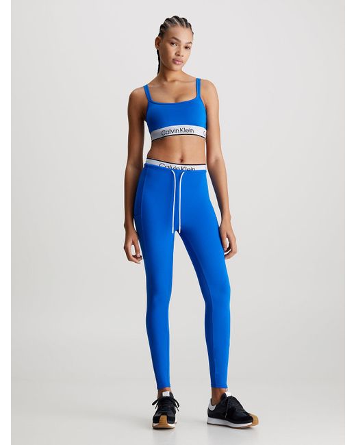 Legging de sport mi-long avec ceinture double Calvin Klein en coloris Blue