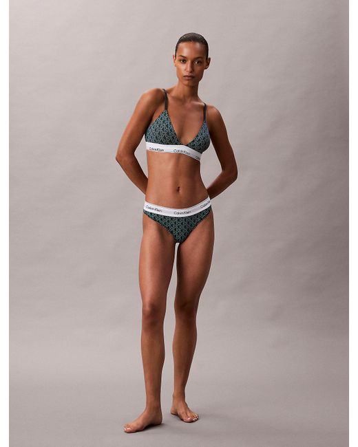 String Calvin Klein en coloris Green