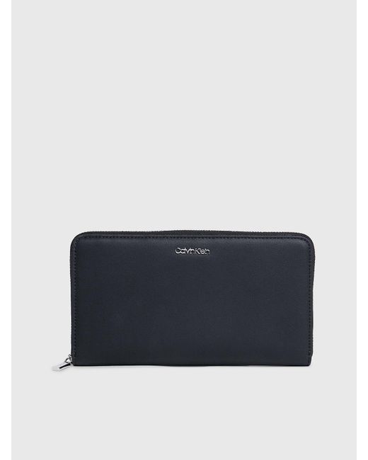 Grand portefeuille anti-RFID zippé Calvin Klein en coloris Blue