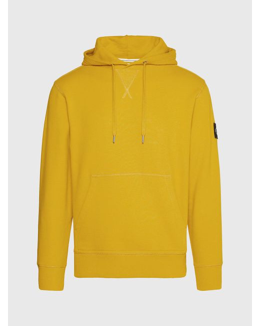 Sweat-shirt à capuche en tissu éponge de coton avec insigne Calvin Klein pour homme en coloris Yellow