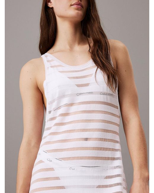Robe de plage en maille rayée transparente Calvin Klein en coloris White