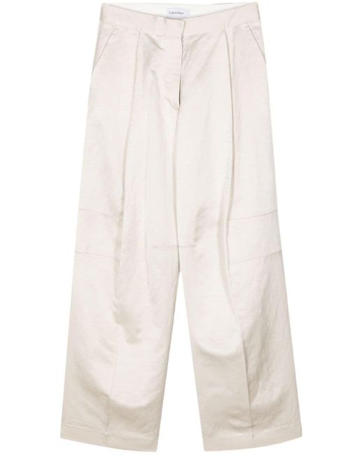 Pantaloni dritti con pieghe di Calvin Klein in White