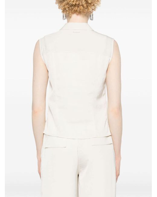 Camicia smanicata con colletto a punta di Calvin Klein in White