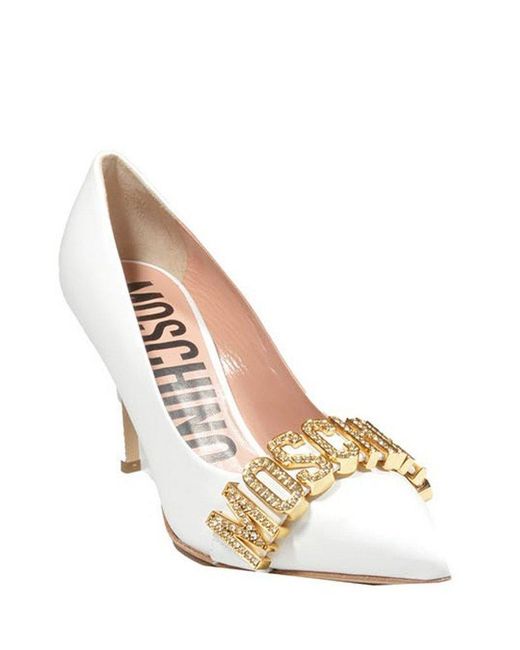 Moschino Crystal Embellished Logo Plaque Pumps in White | Lyst Moschino Crystal Embellished Logo Plaque Pumps in White | Lyst