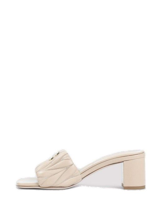 【送料&関税込】Miu Miu Slip-on Sandals Miu Miu Logo-Lettering Slip-On Sandals in Natural | Lyst