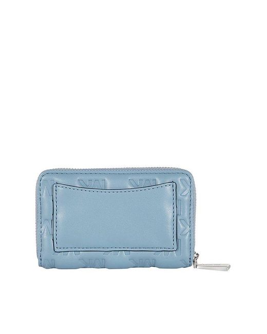 Michael Kors Logo Embossed Zipped Wallet in Blue | Lyst