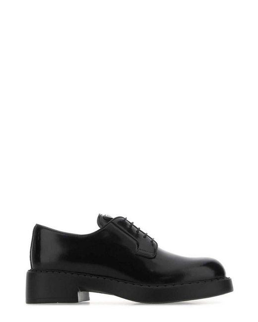 prada logo plaque lace up sneakers
