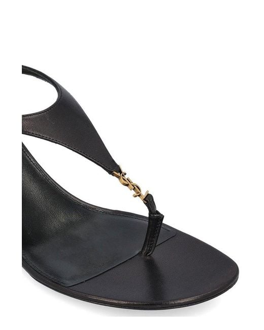 サンダル・ミュール Saint Laurent Black leather Cassandre wedges Saint Laurent Cassandra Wedge Espadrilles In Leather With