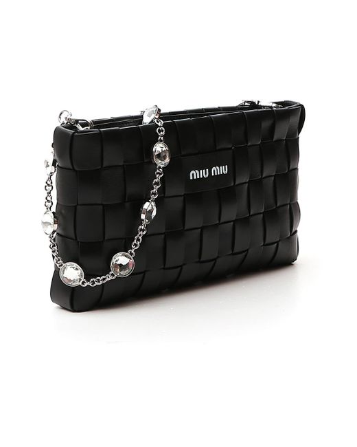 black woven clutch bag