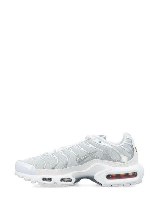 white and silver air max plus