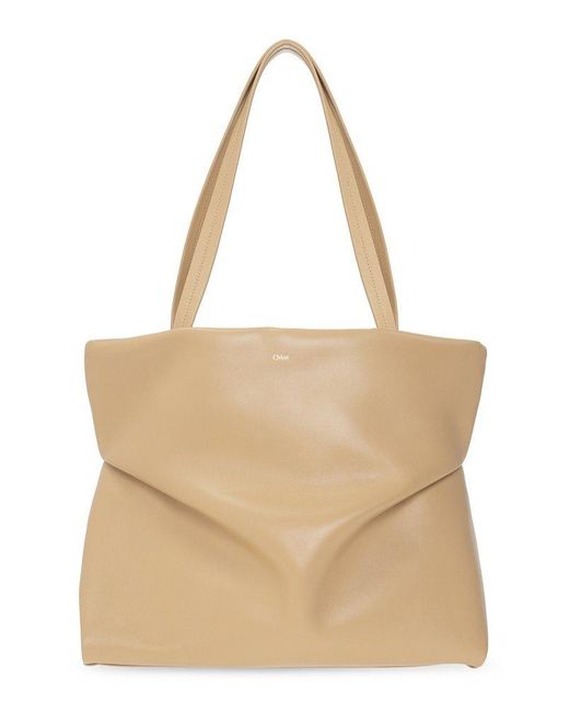 Chloé Leather Judy Logoembossed Tote Bag in Beige (Natural) Lyst