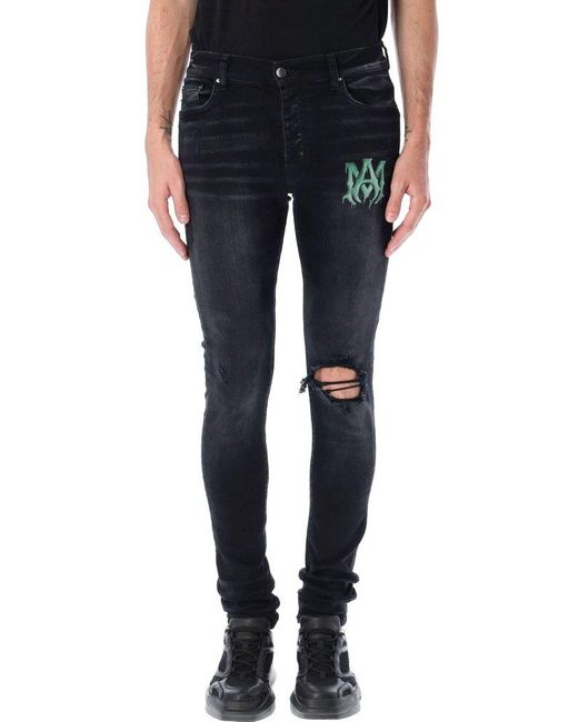 Amiri Denim Watercolor Logo Jeans in 