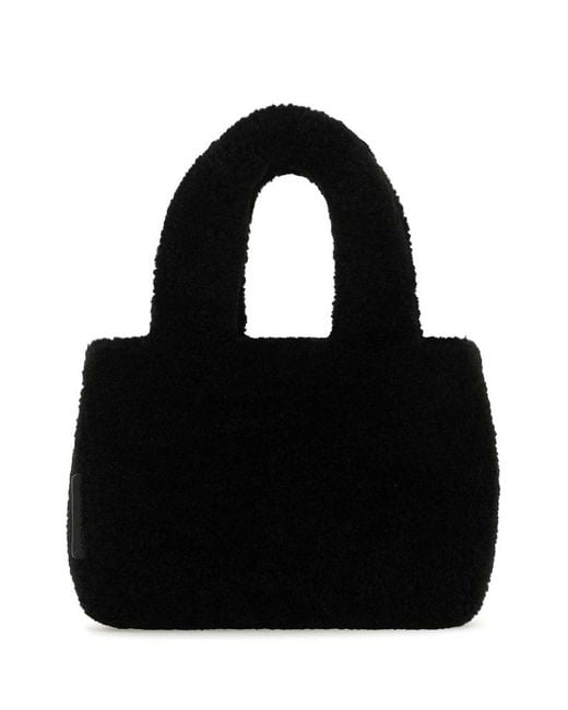 AMINA MUADDI Black Handbags.