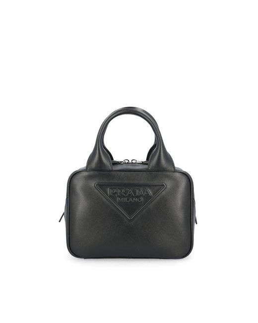 Prada Leather Logoembossed Top Handle Bag in Black Lyst UK
