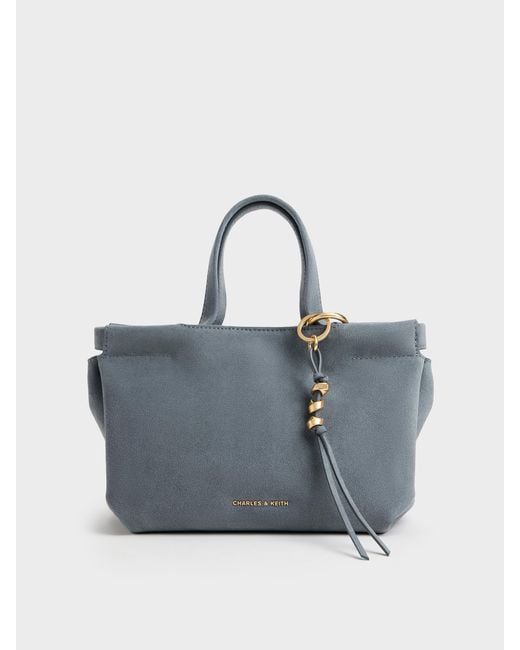 Charles & Keith Blue Mini Zephyr Tassel Tote Bag