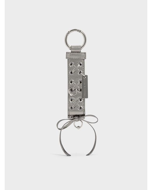 Charles & Keith White Grommet Lace-Up Bag Charm