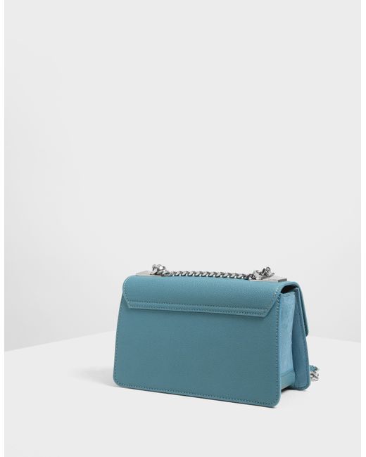 charles & keith metal push lock crossbody bag