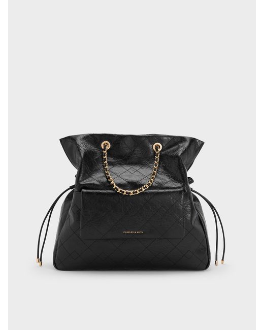 Charles & Keith Black Duo Quilted Drawstring Two-Way Backpack