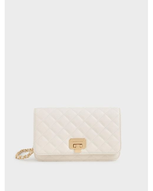 Charles & Keith Quilted Pushlock Clutch in Cream (Natural) Lyst