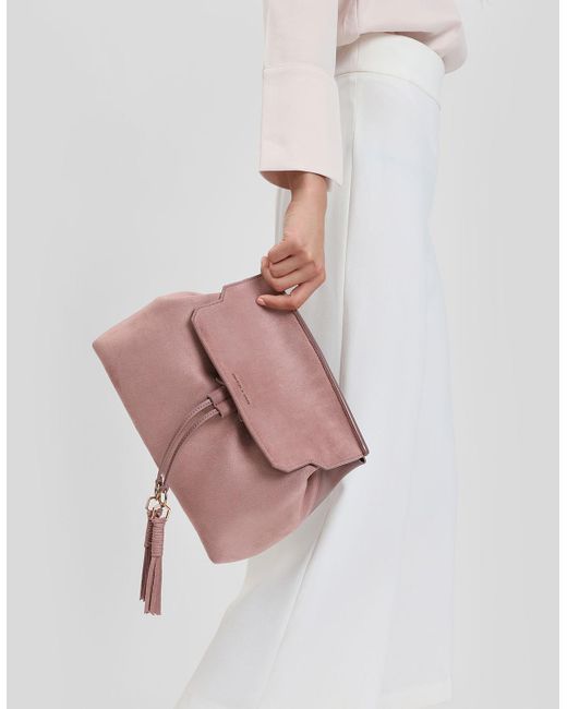 charles and keith tassel backpack