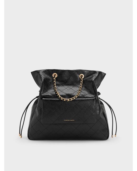 Charles & Keith Black Duo Quilted Drawstring Two-Way Backpack