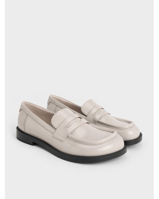 Charles & Keith White Asymmetric Penny Loafers