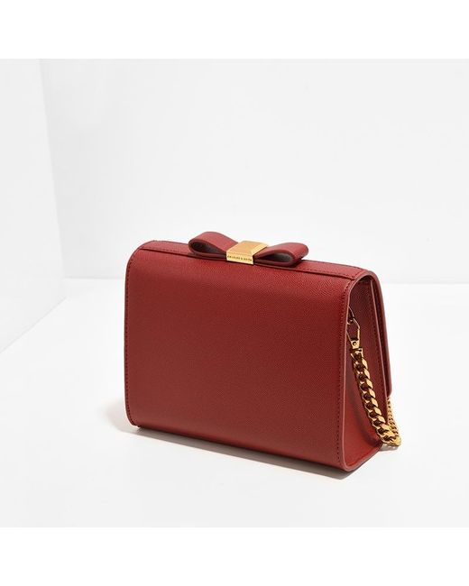 charles and keith bow detail clutch
