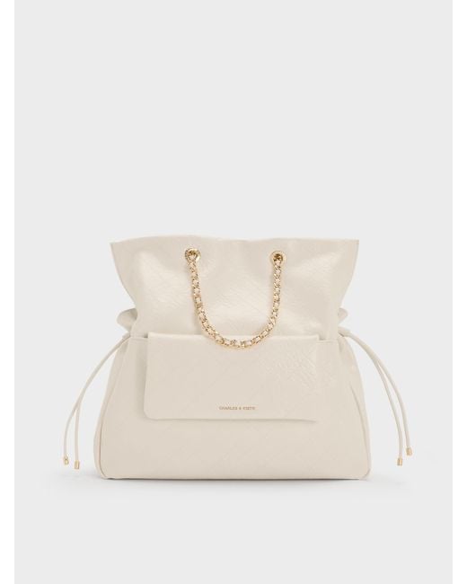 Charles & Keith Natural Duo Quilted Drawstring Two-Way Backpack