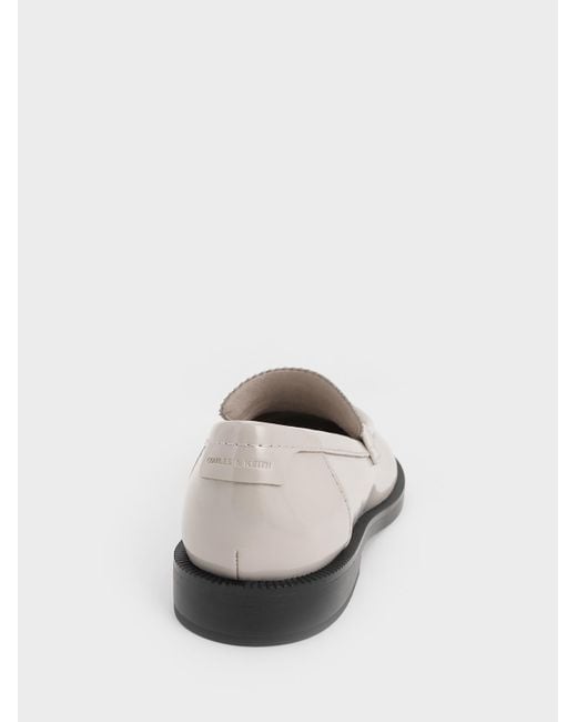 Charles & Keith White Asymmetric Penny Loafers