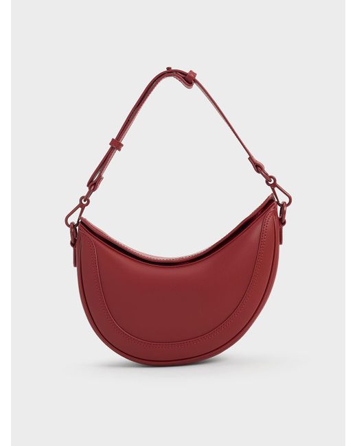 Charles & Keith Red Asymmetrical Saddle Bag