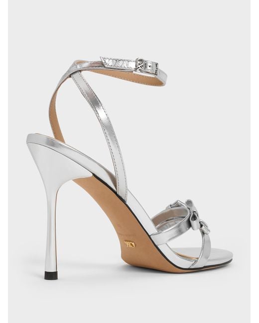 Charles & Keith White Jessy Metallic Leather Bow Ankle-Strap Stiletto-Heel Sandals