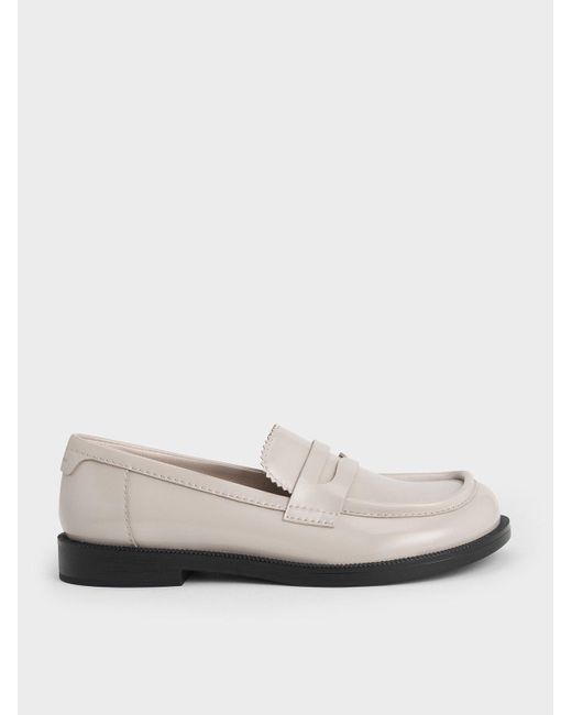 Charles & Keith White Asymmetric Penny Loafers