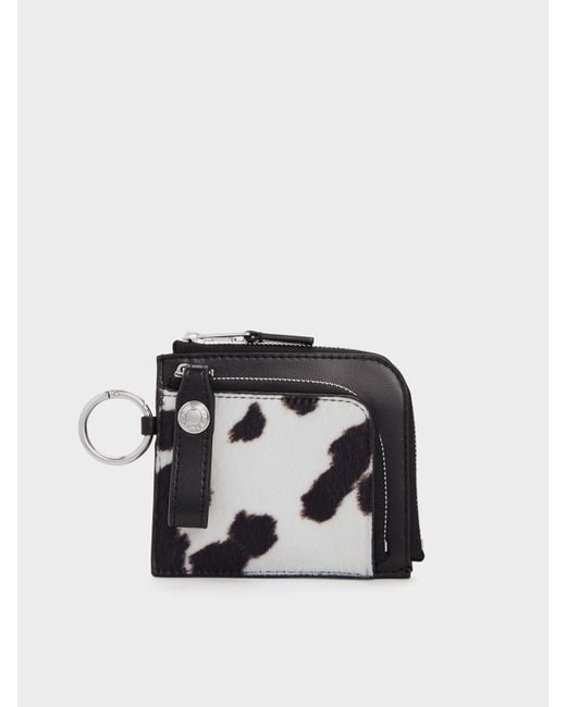 Charles & Keith Black Vega Furry Cow-Print Zip-Around Pouch