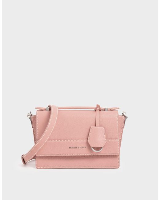 charles and keith pink fur bag