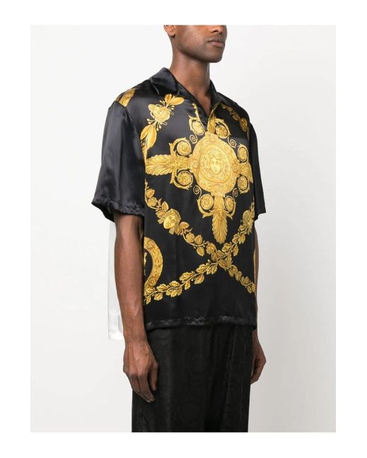 black shirt with gold print